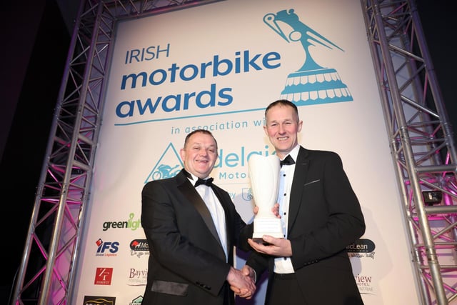 Barry Davidson receives the Classic Bike Festival Services to Sport award from Phillip McCallen.