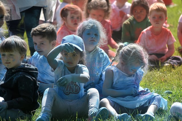 Some of the Ballyoran Primary School kids became almost unrecognisable when covered in coloured powders at the charity colour run on Thursday morning. PT21-208.