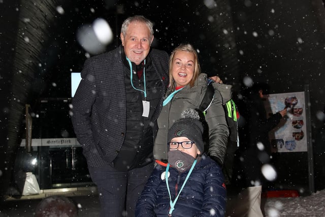 Gerry Kelly President of NI Children to Lapland and Days to Remember Trust is with Aidan Mc Donnell with mum Lucy from Glenravel as they arrive in Lapland.