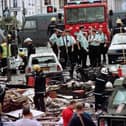 RUC officers and firefighters inspect the damage caused by the Omagh Bomb in 1998. Photo: PA