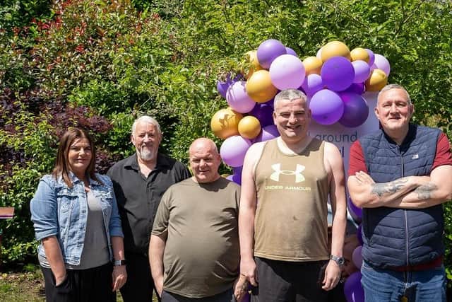 Pictured at the 40th anniversary event for Praxis Care in Magherafelt are Shirley Anne Hyslop and Paul Gomac with people they support. Credit: Submitted