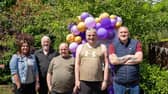 Pictured at the 40th anniversary event for Praxis Care in Magherafelt are Shirley Anne Hyslop and Paul Gomac with people they support. Credit: Submitted