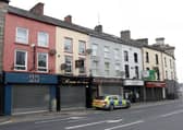 Police at the scene of the suspected stabbing in the Upper Water Street area of Newry. Picture: Pacemaker