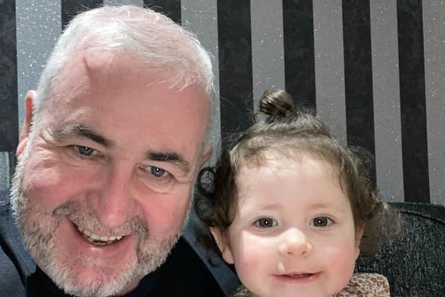 Roy Harrison, from Cookstown, pictured with his granddaugher is thankful for the support provided by Charis Cancer Care. Credit: Submitted