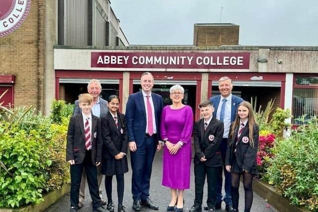 Principal Maria Quinn, pictured welcoming Education Minister Paul Givan to Abbey Community College recently, receives an MBE. Photo: submitted