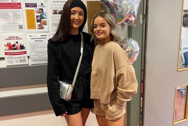 Abbie and Rebecca celebrating the end of chemo for Rebecca. Pic credit: Teenage Cancer Trust