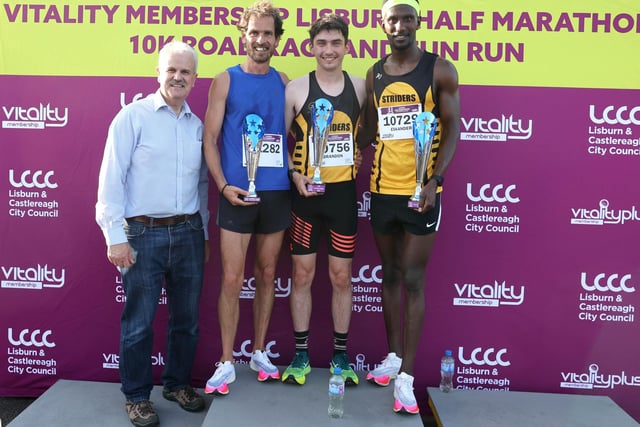 Chairman of the Communities and Wellbeing Committee, Councillor Thomas Beckett presented Winners In the men's 10K, Brandon McKeown finished in first place, closely followed by Eskander Turki in second place and Gareth Lyons in third. Pic Credit: Lisburn and Castlereagh City Council