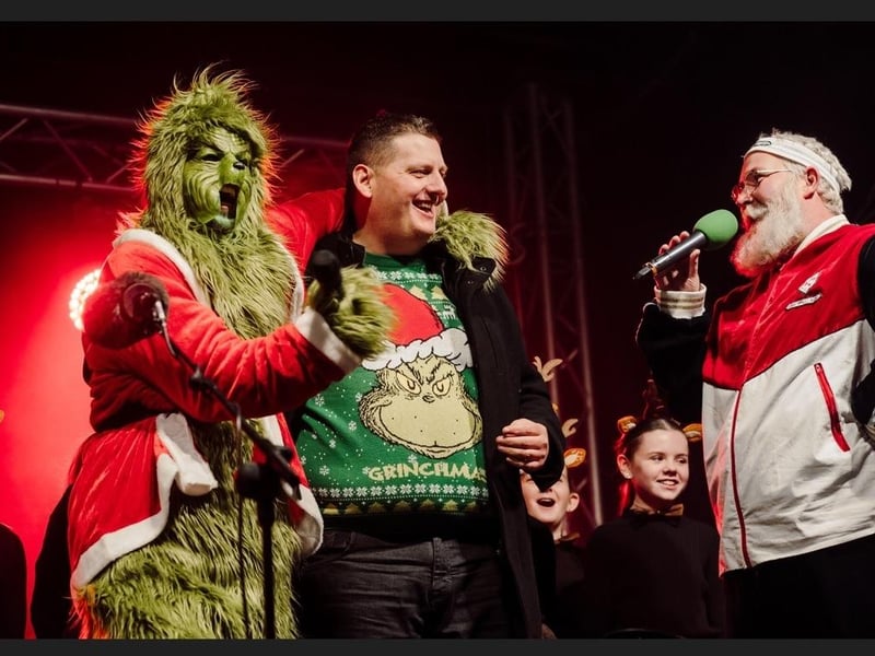 Stuart Robinson alongside the Grinch and Santa.