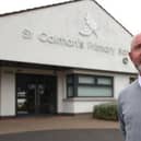 Principal Stephen Baine outside St Colman's Primary School in Lambeg, which received a threatening email on Monday morning. Picture: Liam McBurney / Press Association