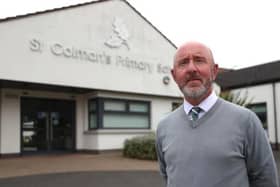 Principal Stephen Baine outside St Colman's Primary School in Lambeg, which received a threatening email on Monday morning. Picture: Liam McBurney / Press Association