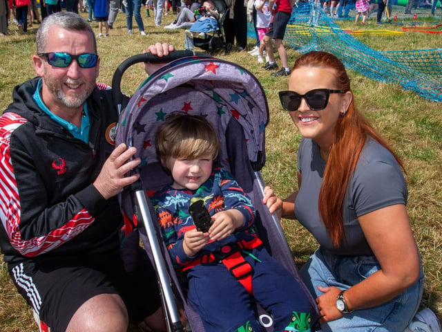 Having fun at the Drumcree Parish Garden Fete are from left, Mark McCrory, Odin McClure (3) and Hannah McCrory. PT23-223.