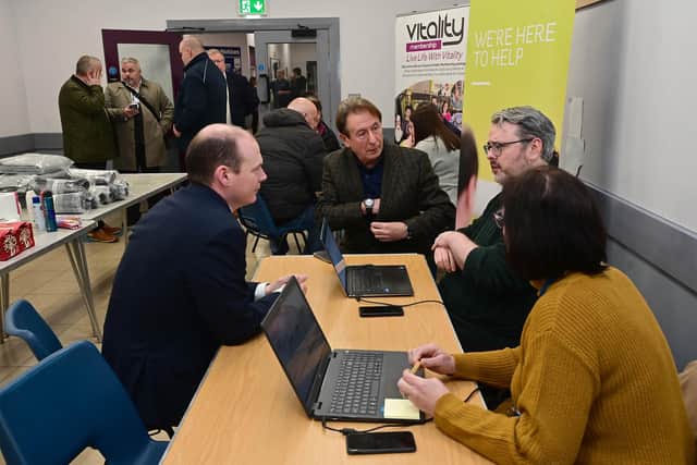 Minister Lyons is pictured with representatives from NIE. Photo: submitted