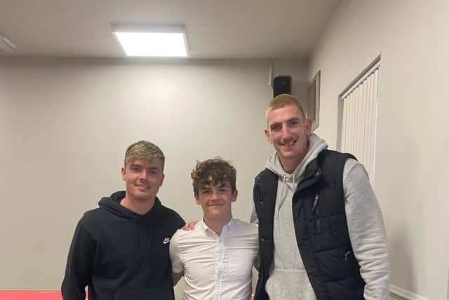 The Medallion Most Improved Player, Oscar Scullion, with Jake and Frank.
