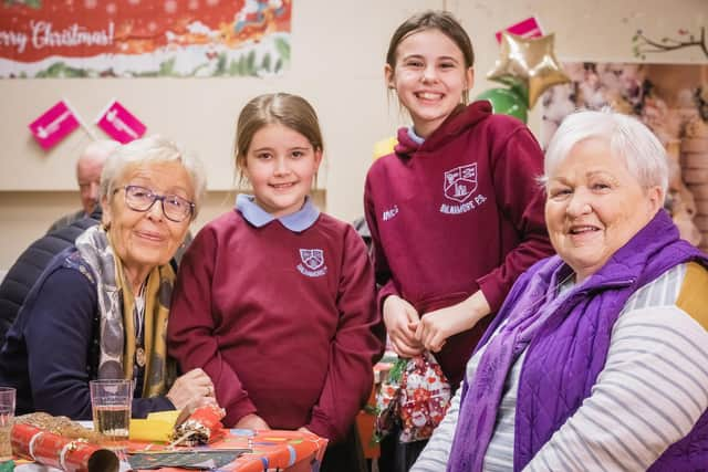 Valerie Davis and Lorna Stewart with Emilee Elder and Imogen McGuinness, enjoying the festivities at Balnamore Community Association’s Christmas dinner, funded by The National Lottery Community Fund