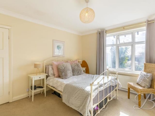 The second of the larger bedrooms is also a comfortable space. The window looks out on to the back garden.