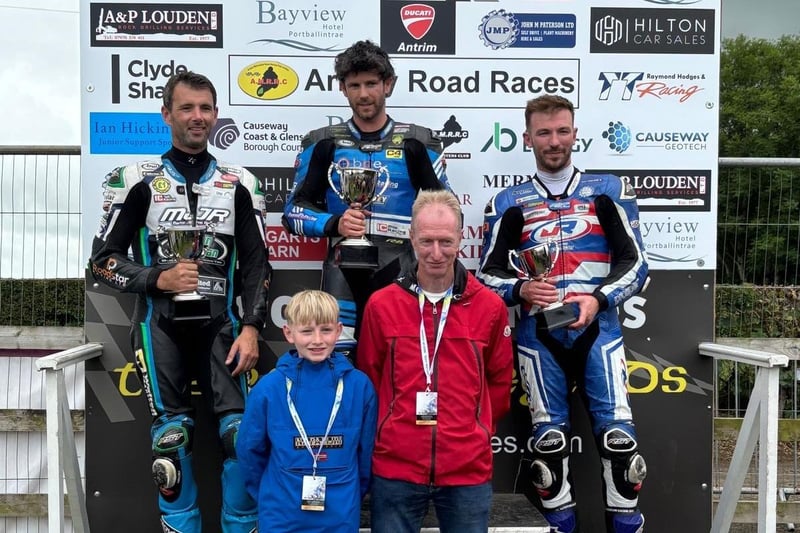 Norman McFarlane, from N. McFarlane Tarmac Contractors in Coleraine, and his son are pictured with the winners of the Open race.
