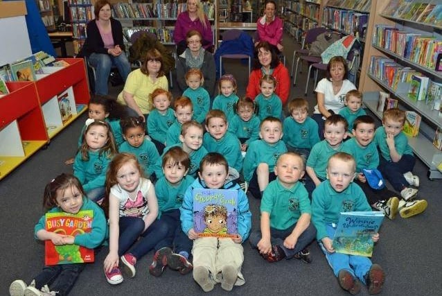 Chilren from Glengormley Integrated Primary School Playgroup pictured with staff members, Dorothy Swain, Jan Ferguson and Fiona Lynn and support staff on their visit to Glengormley Library in 2013.