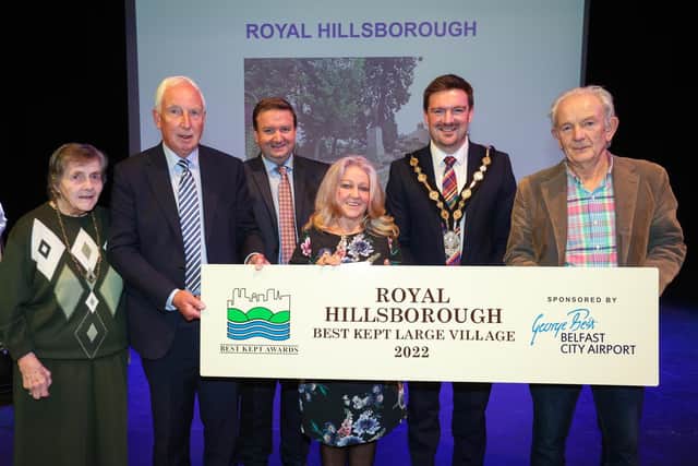 Royal Hillsborough won the ‘Best Kept Large Village Award’ at the 2022 Best Kept City, Town, Village and Housing Area Awards. Pictured are President of The Northern Ireland Amenity Council, Doreen Muskett MBE, David Reid, Dawn Mitchell McEntee, Stephen Patton, Human Resources and CR Manager at George Best Belfast City Airport and Ken McEntee.
