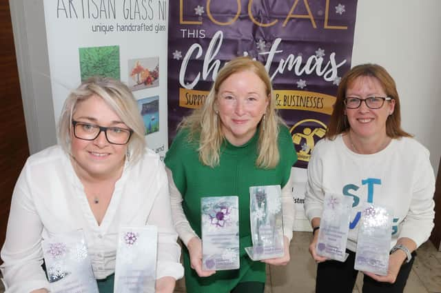 Denise Loughrey of Artisan Glass NI, Geraldine Wills (left) and Catrina McNeill, Council’s Town and Village Management officers, launch this year’s Christmas window display competition. Credit Causeway Coast and Glens Council