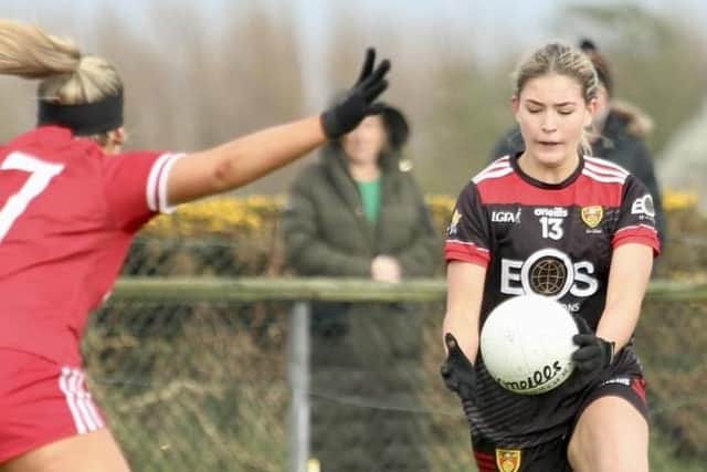 Niamh McClory eases past her Louth opponent.