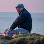 This is a closer shot of the gentleman from the couple who were snapped by photographer Danielle Murphy as they watched the sunset at Ramore Head on Saturday, May 25. Can you help find them? Credit DMPhotography NI