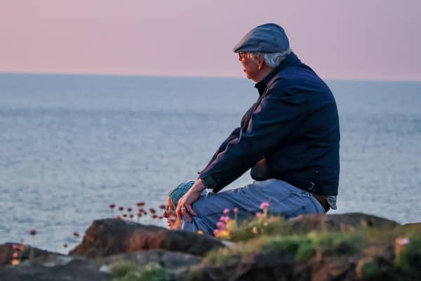 This is a closer shot of the gentleman from the couple who were snapped by photographer Danielle Murphy as they watched the sunset at Ramore Head on Saturday, May 25. Can you help find them? Credit DMPhotography NI