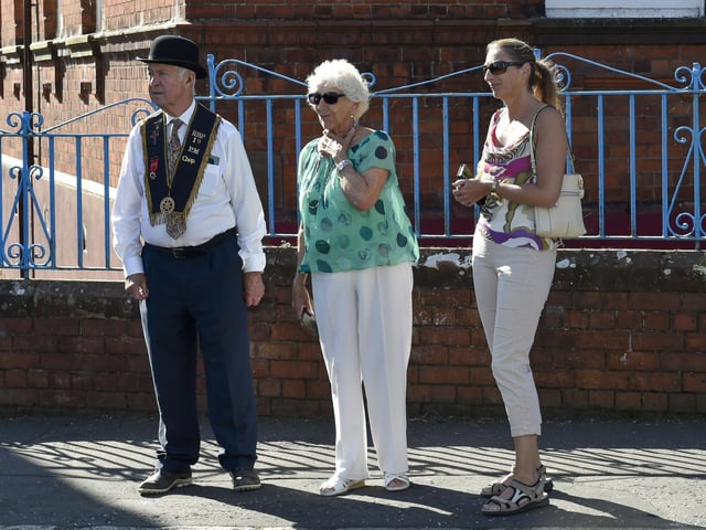 On the sunny side of the street to watch the Royal Black Institution parade annual July parade around Lurgan town centre.