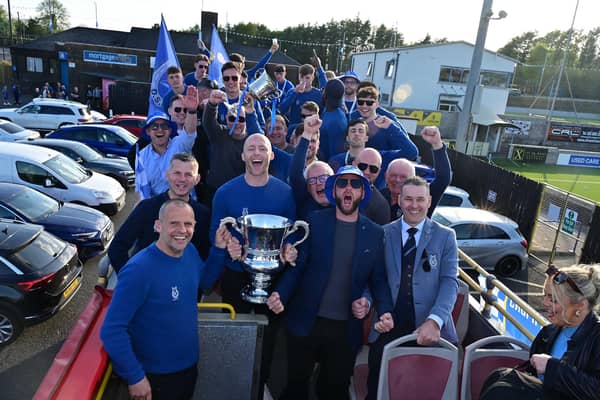Irish Cup winners Dungannon Swifts enjoy a open top bus tour through the town.