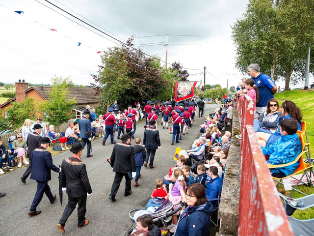 A section of the crowd enjoying the parade in Loughgall from a good vantage point.