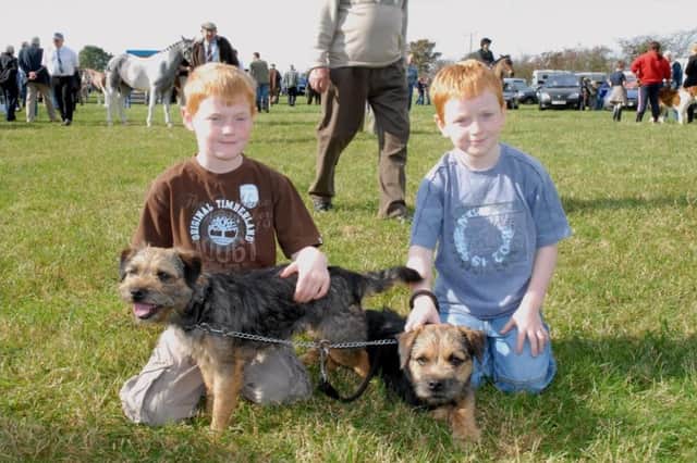 Enjoying Mounthill Fair in 2007 were Peter and Andrew Curry with their border terriers Scruff and Blue.