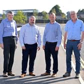At the completed road at the St Patrick’s regeneration Sste are: David McQuitty, Department for Infrastructure; Gerard Murray, director regional development office, Department for Communities; Roy McNeilly, contracts manager, FP McCann Ltd and Gerard McLarnon, technical director, Amey Consulting Ltd. Photo submitted by Department for Communities