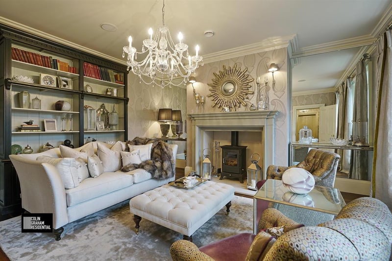 Lounge with polished limestone inglenook fireplace.