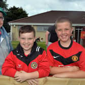 Leslie Conn, son Matthew (12) and friend Connor O'Hagan pictured at the charity fun day and football match on Sunday. LM32-209.