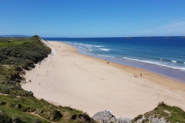 Based just off the Causeway coastal route, Whiterocks Beach is mere miles from Portrush and also offers a great scenic location to surf on.
On clear days, you can spot the Scottish Islands whilst surfing across the calm waves, passing kayakers, bodyboards and more.