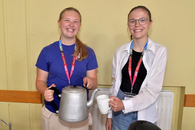 Time For Tea ... Zara Jackson, left, and Faith Miskelly pictured at the Thomas Street Methodist Youth Fellowship coffee morning on Saturday. PT26-218.