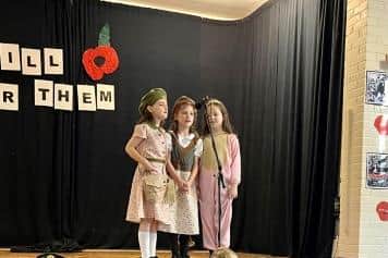 Remembrance service at Edenderry Primary School, Portadown. The girls sing a solo song.