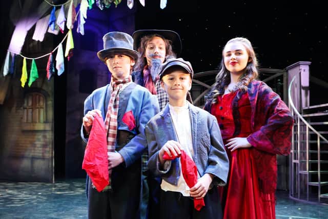 Pond Park Primary School pupil Mason McLaughlin as Oliver, Caroline McMichael, who takes on the role of Nancy, Jackson Allen as Fagin, and Conor Kelly as the Artful Dodger. Pic credit: Grand Opera House Belfast