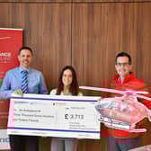 Donnelly Group employees Abbie Montgomery and Gary Haffey with Damien McAnespie, Area Fundraising Manager for Air Ambulance