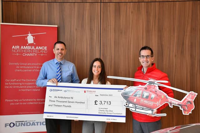 Donnelly Group employees Abbie Montgomery and Gary Haffey with Damien McAnespie, Area Fundraising Manager for Air Ambulance