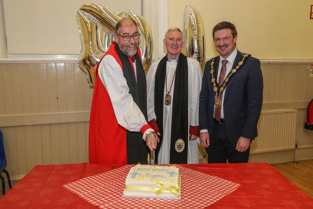The Bishop cut an Anniversary Cake to mark 400 years at Lisburn Cathedral. Pic by Norman Briggs, rnbphotographyni