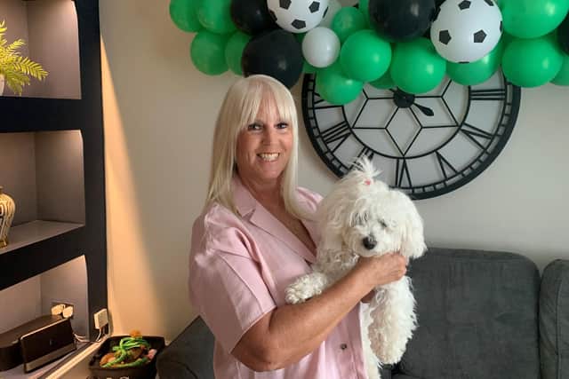 Foster carer Joanne Ellison and dog Poppy in her Lisburn home. Pic credit: SEHSCT