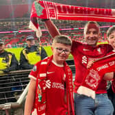 TAKE IT AS RED...Local businessman Ben Graham, along with sons Olly and Eli, cheering Liverpool to a dramatic win against Chelsea.