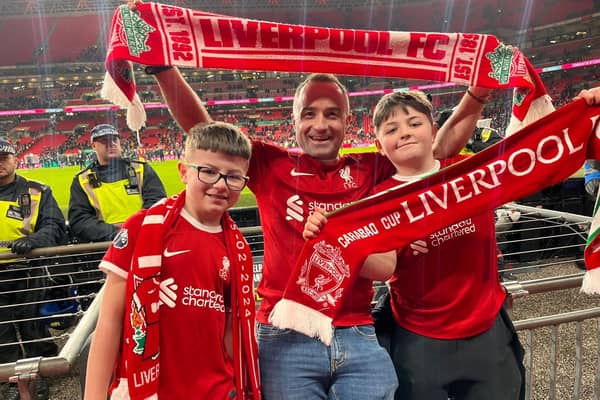 TAKE IT AS RED...Local businessman Ben Graham, along with sons Olly and Eli, cheering Liverpool to a dramatic win against Chelsea.