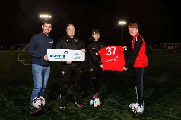Pictured (L-R) is Power NI’s Barry Rogan, Head Coach Karl Wells, and two Under-15 players.