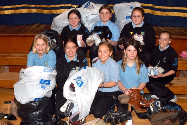 Carrick Primary School pupils with some of the shoes they have collected for the Blue Peter Shoebiz Appeal in March 2007 in support of UNICEF. They are Carissa Mitchell, Leanne McCallum, Lauren Jones, Linzi Tipping, Olga Patrova, Lindsey France, Jessica Gray and Laura Robinson.