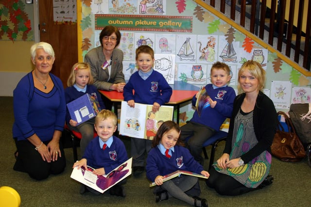 Madison, Dylan, Luke, Adam and Tamara, of Macosquin PS reading Halloween stories at Coleraine Library in 2009. Included are Bernadette Kennedy, Bertha Madden, and Jessica Glasgow.