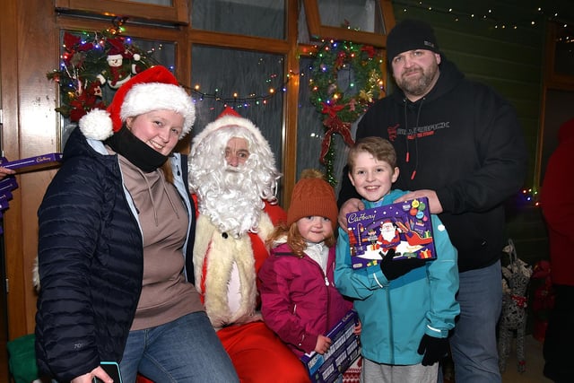 Posing with Santa at the Richhill Christmas lights switch on are members of the Allen family including, mum, Julie, Dad, Jonnie with children, Caleb (8) and Cerys (4). PT49-251.