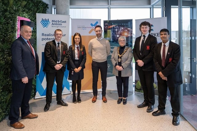 Pictured at Clarke in Broughshane are Mr Heaney, Ballymena Academy; Eugene Clarke (centre); the Deputy Mayor of Mid and East Antrim, Councillor Beth Adger MBE and Ballymena Academy Pupils.