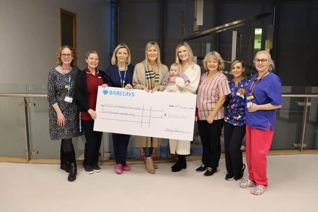 ome From Home, Labour Ward and Neonatal Intensive Care Unit staff being presented with a £6000 cheque by Ali Hill, Becki and baby Quinn Garside.
