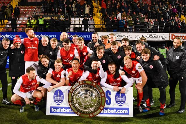 Larne celebrate victory in the County Antrim Shield final after beating Glentoran at Seaview